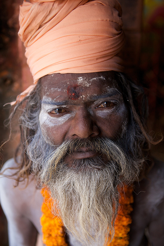 Marigold flower necklace worn by devotee, sadhu project photography