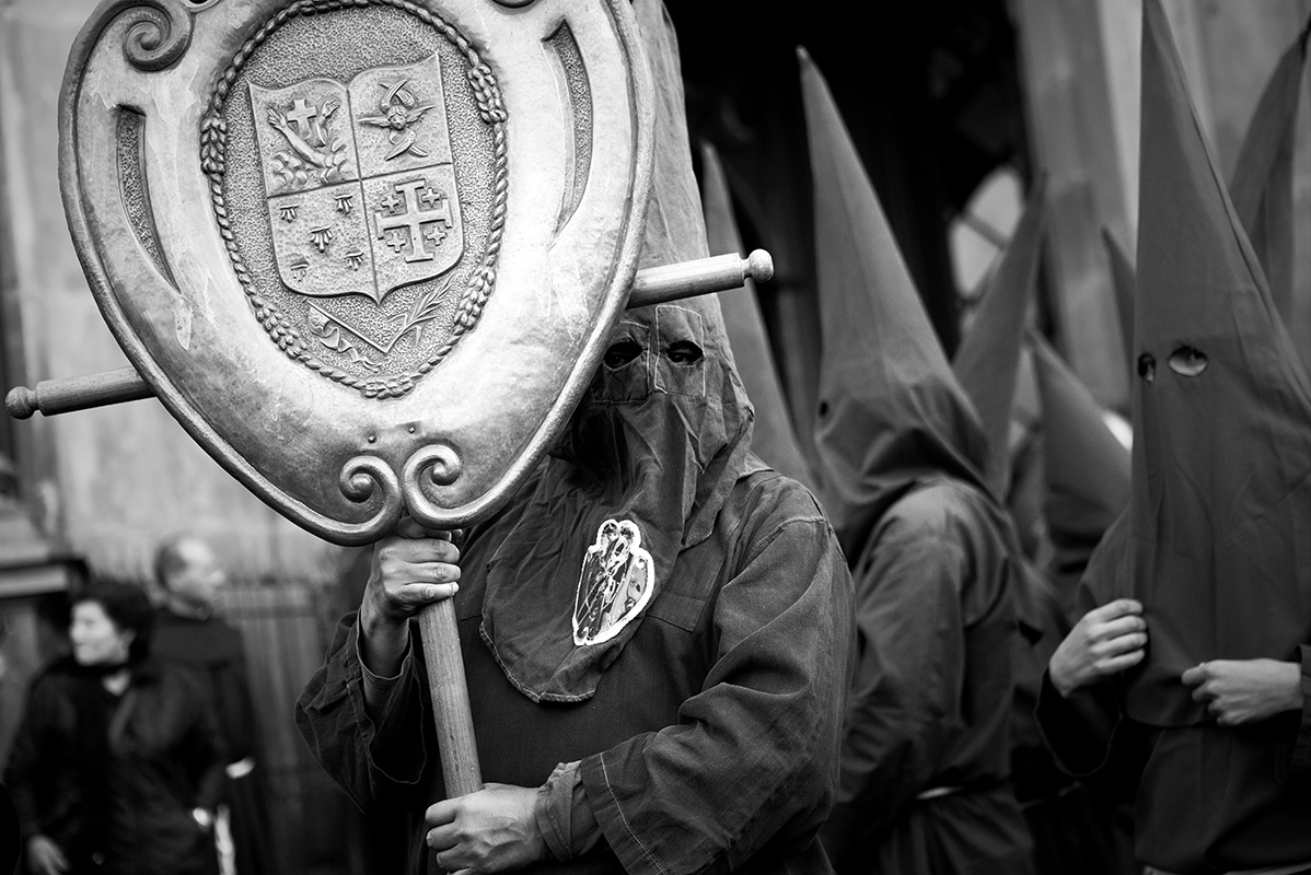 Cloaked and hooded Christian worshippers begin parade