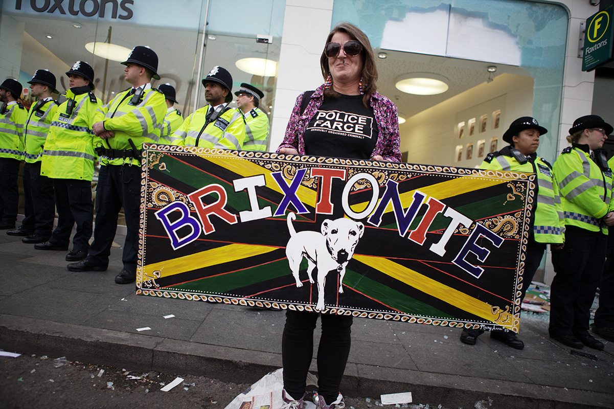 Riot squad protect Foxtons estate agents from mob violence