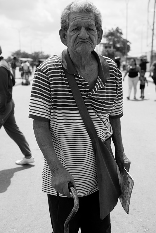 Sick old man waits for help