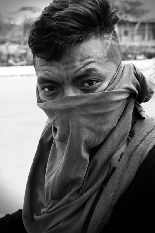 Masked man portrays violence to foreigners