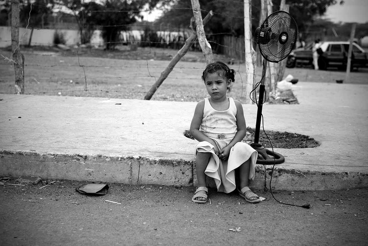 Young refugee waits for family